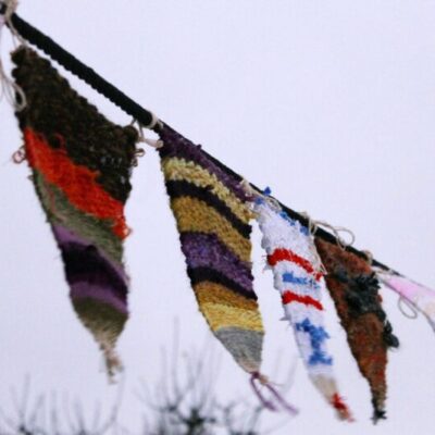Weave pennants in our drop-in workshop.